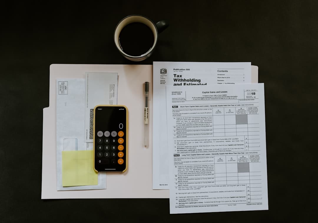 Tax forms and documents on a desk during financial planning