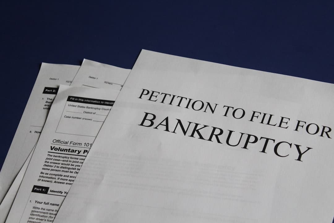 Florida homeowner reviewing Chapter 13 bankruptcy documents at kitchen table to stop foreclosure on their home