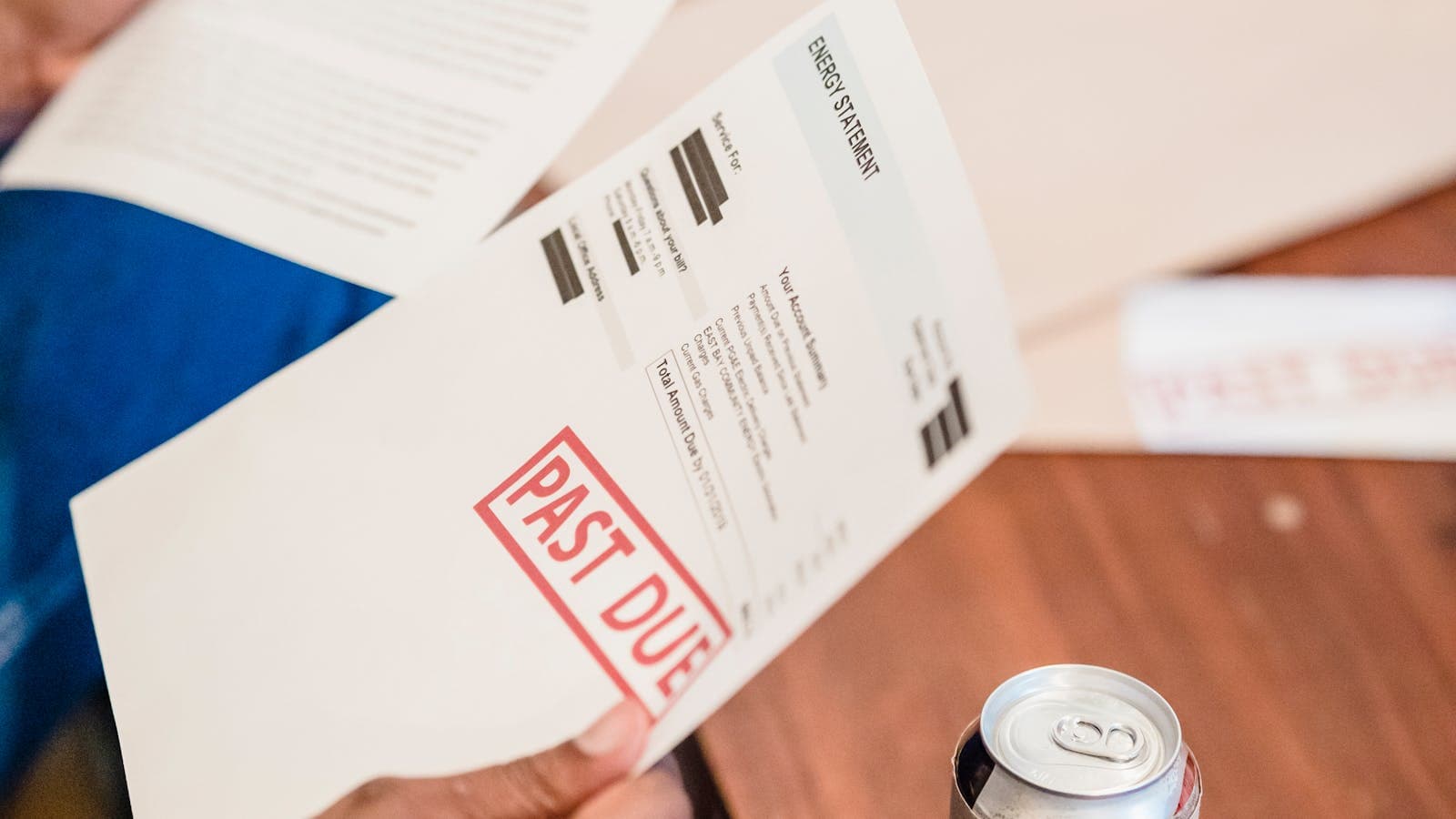 Homeowner reviewing multiple mortgage documents and loan statements