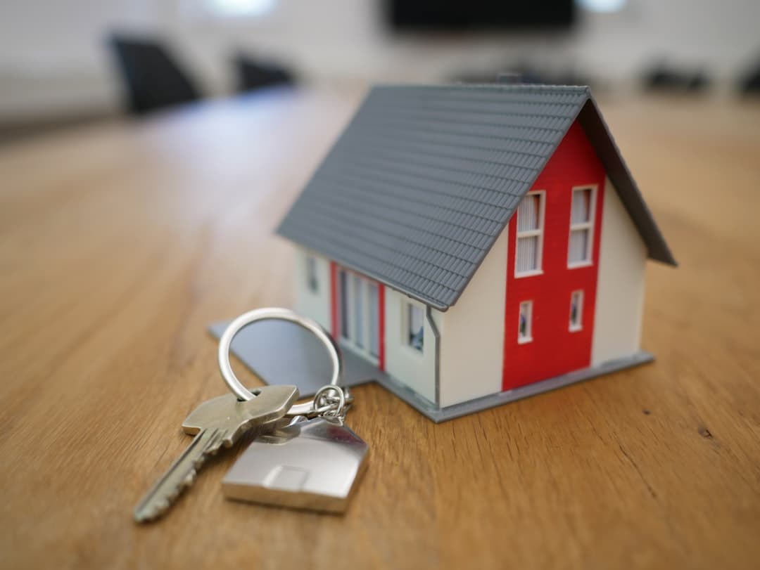 Florida homeowner reviewing a cash for keys agreement with a housing counselor at a kitchen table