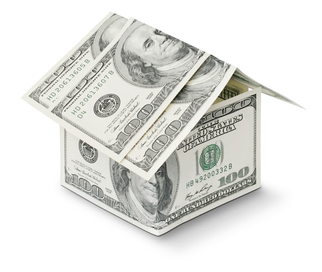 Florida homeowner reviewing mortgage documents at kitchen table after cash-out refinance