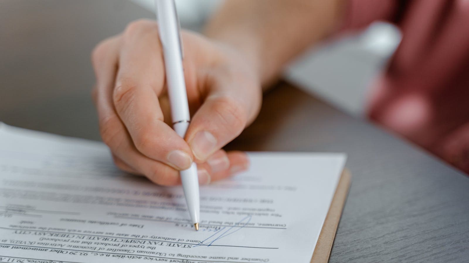 Florida homeowner reviewing foreclosure lawsuit documents at kitchen table