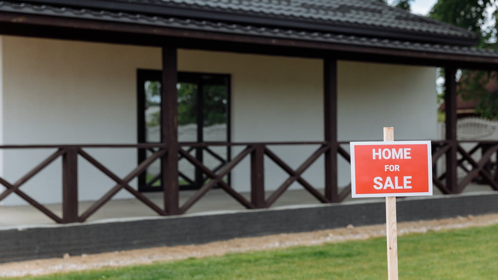 Florida home with a for sale sign and as-is condition exterior