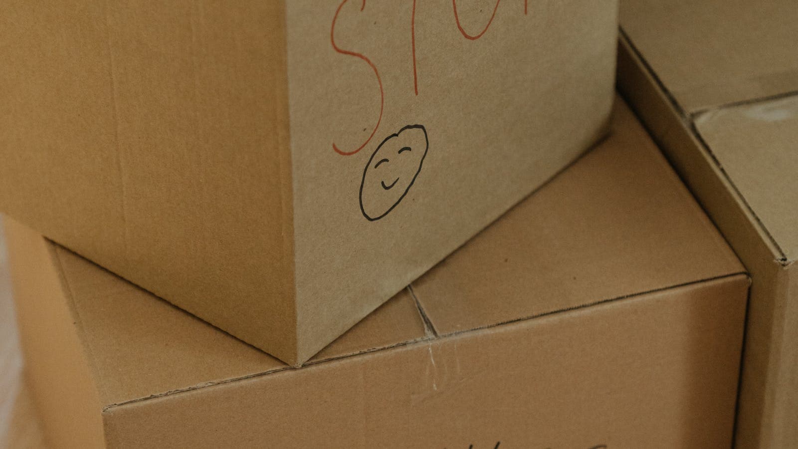 Moving boxes and personal belongings being packed for relocation after foreclosure